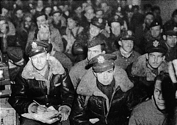 Crew members at a briefing, thier facial expressions say it all. Photo courtesy 451st BG assoc.
